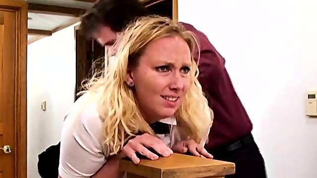 Femdom mistress spanking a blonde restrained sub