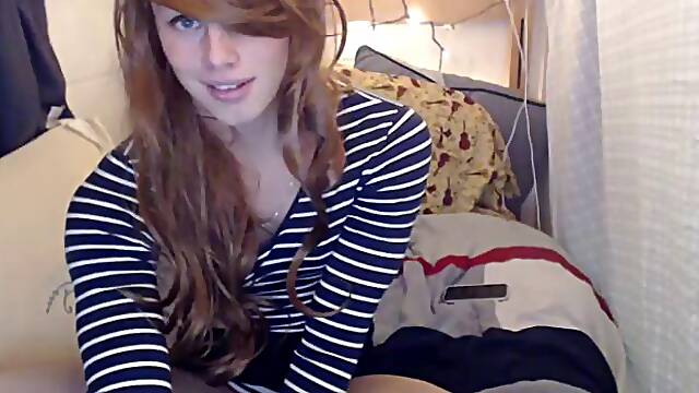 Red-haired harridan with caged penis pleases ass with small toy