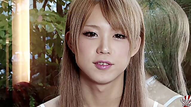 Slender and cute Japanese girl with a dick does a striptease