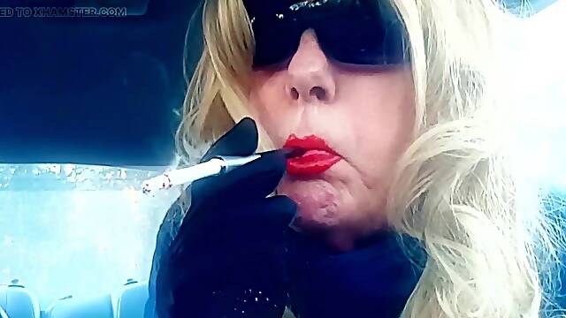 A GOLDEN-HAIRED MRS. RUTHIE ROMAN AGED SMOKIN' VS120's IN A CIGARETTE HOLDER