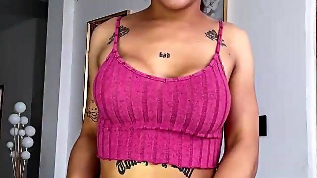 Tattooed haunches sway as this babe slips her shorts down slow