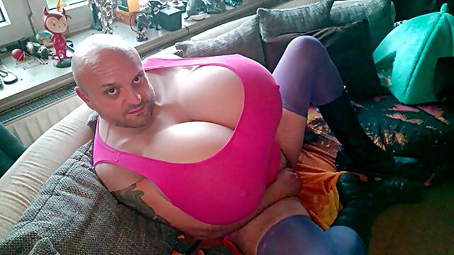 Huge tits Cup-Z crossdresser in a fetish outfit with boots massages and kneads his big breasts. Extremely large xl boobs in pink