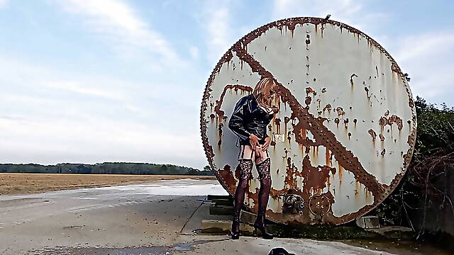 Crossdresser Playing Down on the Farm in PVC