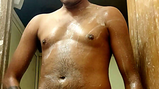 India boy cold water nude shower
